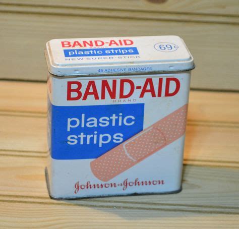 metal band aid box|bandaids in a metal container.